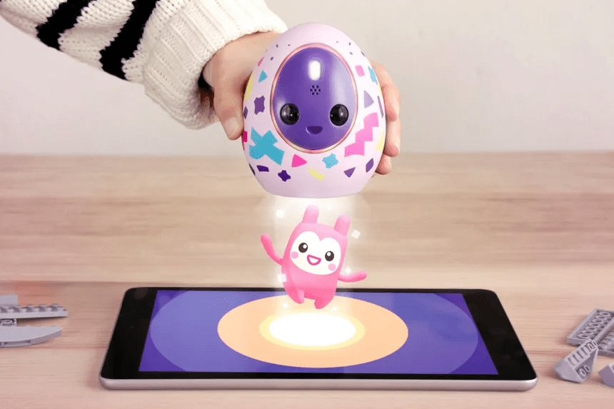 Girl lifting up the Melbits Pod revealing a new Melbit inside